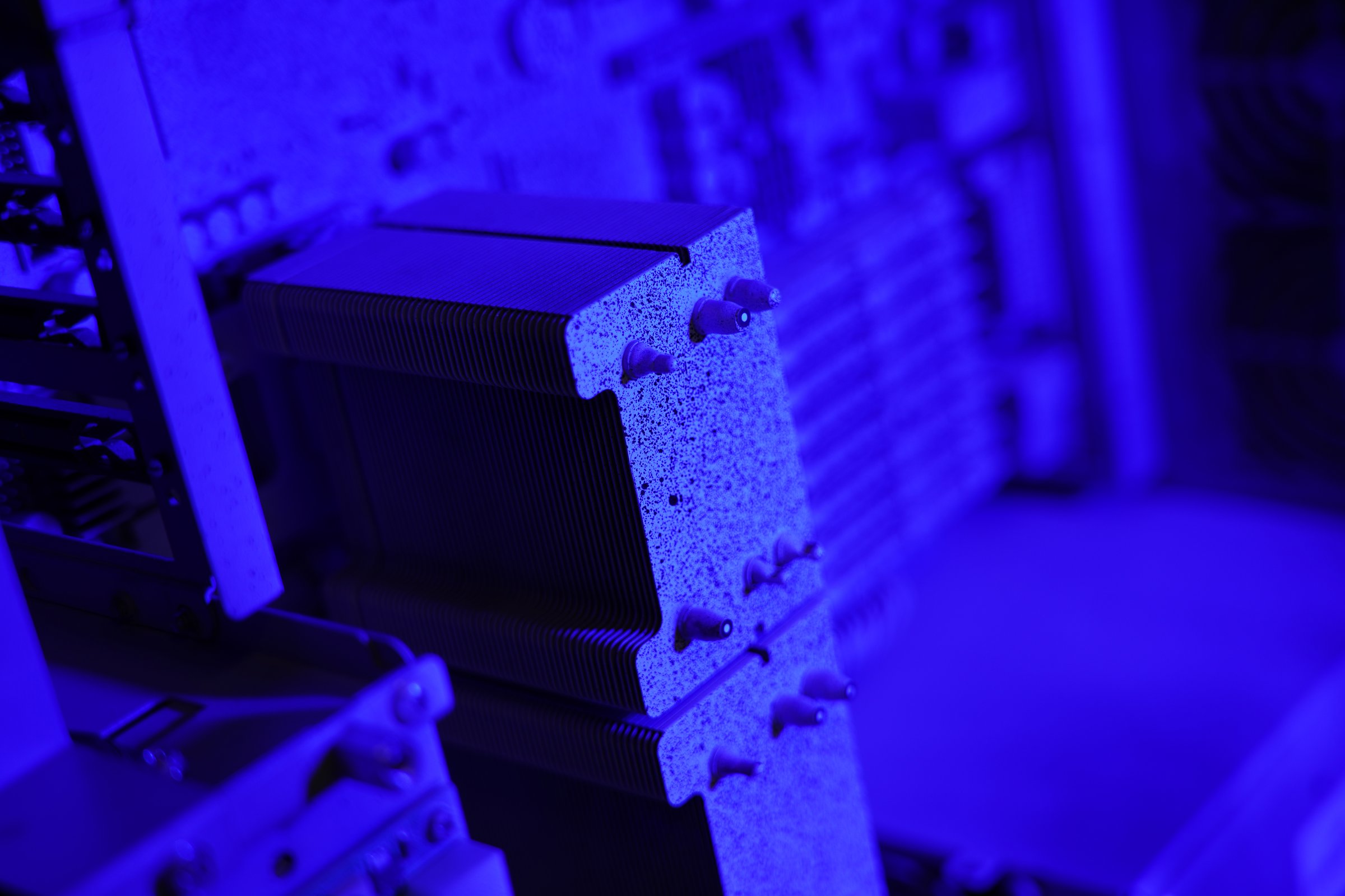 Close-up of a speckle patterned electronics component instrumented for ARAMIS SRX measurement.